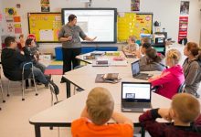Students learning computer skills in a rural classroom