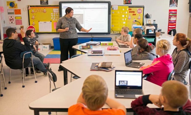 Students learning computer skills in a rural classroom